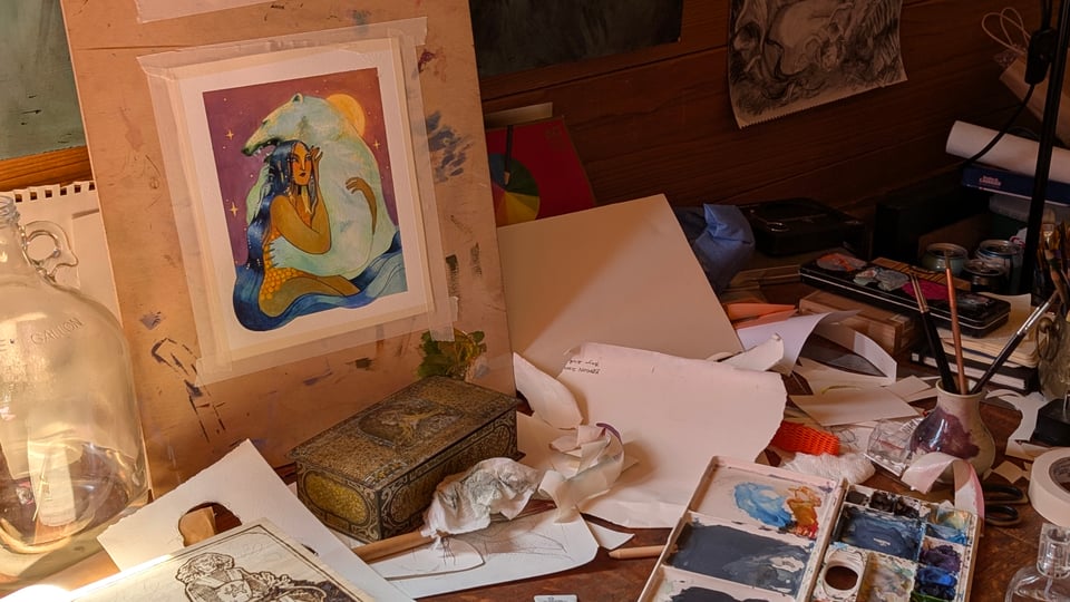 A messy photo of my desk a painting in progress