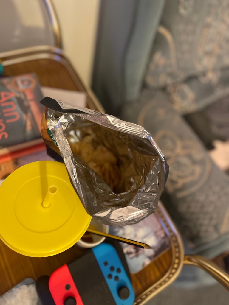 Crisps and a drink on a table
