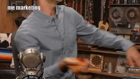 a man in glasses labeled "me marketing" flings spaghetti against a world map, asking "am I doing this right"