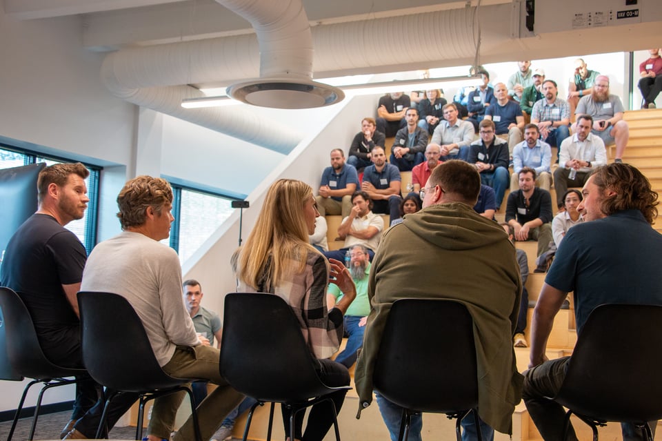 A photo from behind the panel showing the attendees