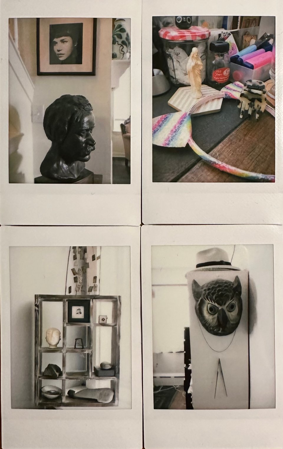 photo of 4 Instax images: top left, a bust of Konrad Bercovici below a photo of his daughter; top right, some rainbow cat-ears on a desk beside a figure of Jesus and some art supplies; bottom left, a wooden display case with various objects; bottom right, the side of a white filing cabinet from which hangs an owl mask and a protractor, with a straw hat on top of the cabinet.