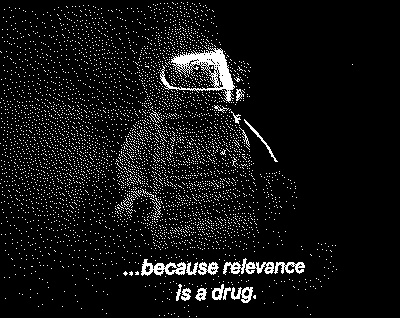 A bitmap image of a Lego minifig in a spacesuit. Subtitles below read "...because relevance is a drug". A line by Pharrell Williams, reflecting on the relationship between the creative person and the audience.