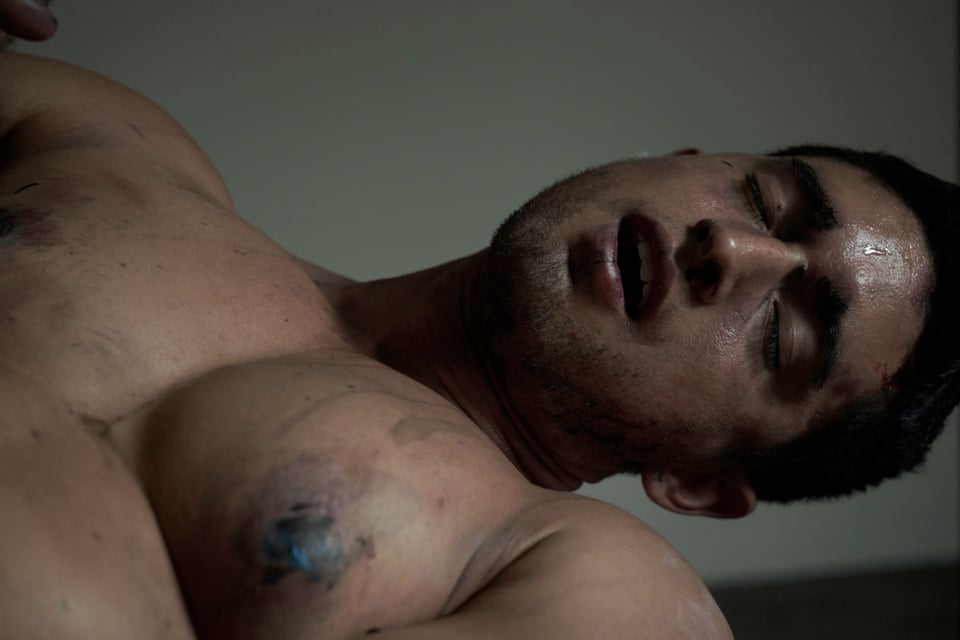 close up of a sweaty dirty man with his eyes closed