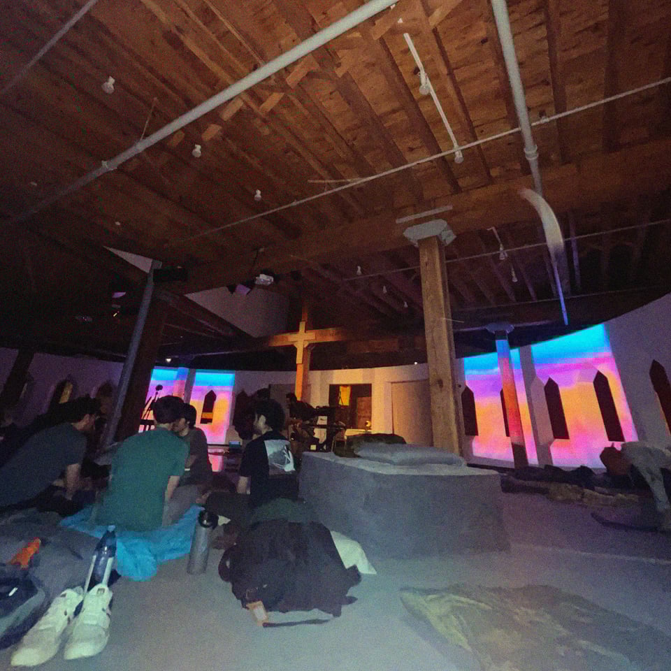 people settling in at grace place church for the drone sleepover