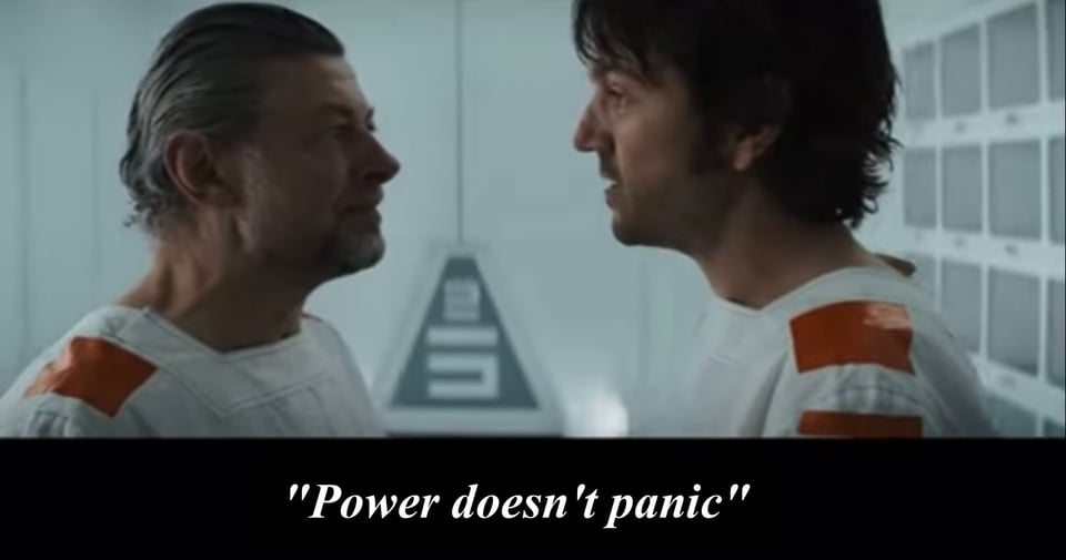 A screencap from "Andor," in which Andor tells fellow prisoner Kino Loy: "power doesn't panic."