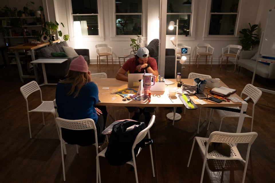 Madison and Alex working at a table