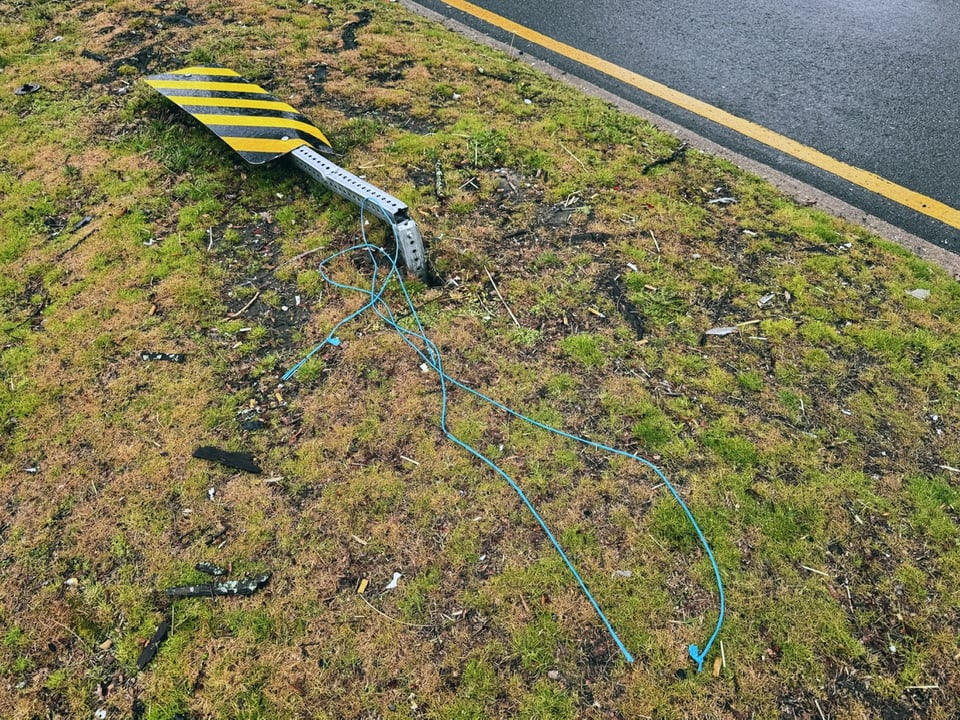 A sign, ostensibly meant to encourage drivers to drive more cautiously, but has been mowed down by a driver.