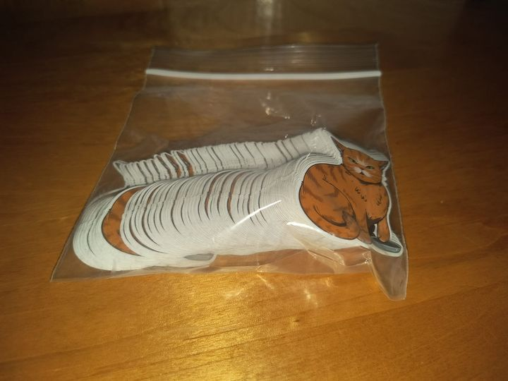 Picture of a baggie filled with stickers of Bundersnoot demanding to be fed.