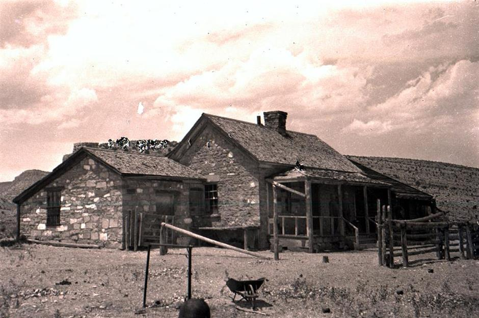 An old ranch and outbuildings in 19th century America