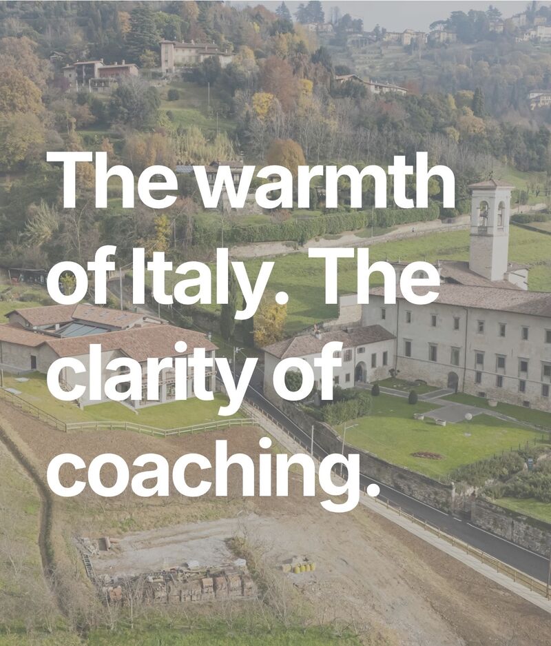 An aerial photo of the CIID Campus in Bergamo, Italy with the text "The warmth of Italy. The clarity of coaching." overlaid over the top.