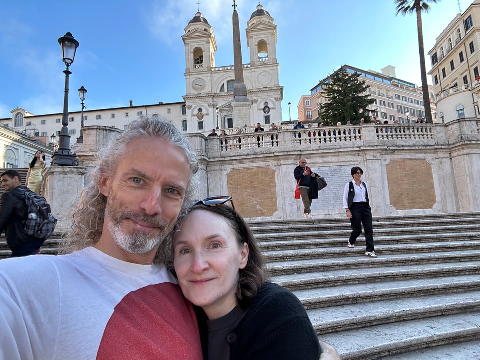 Selfie-photo of a white man & woman standing on the Spanish Steps in Rome