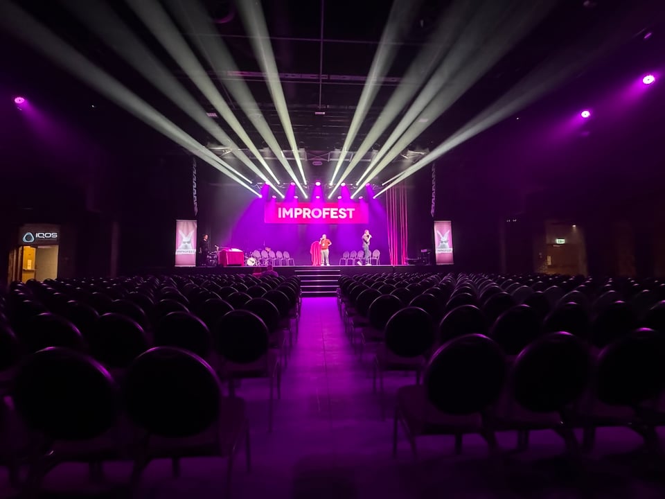 A giant stage with concert-style lights shooting out all over the place.