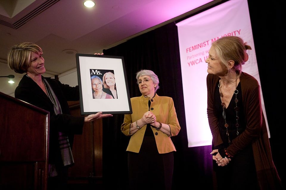 Gloria Steinem (right) is presented with a framed copy of the Fall 2009 cover of Ms. magazine, featuring her and Alice Walker, by Ms. executive editor Kathy Spillar (left) and Ms. publisher Ellie Smeal, on Oct. 5, 2009, in Washington