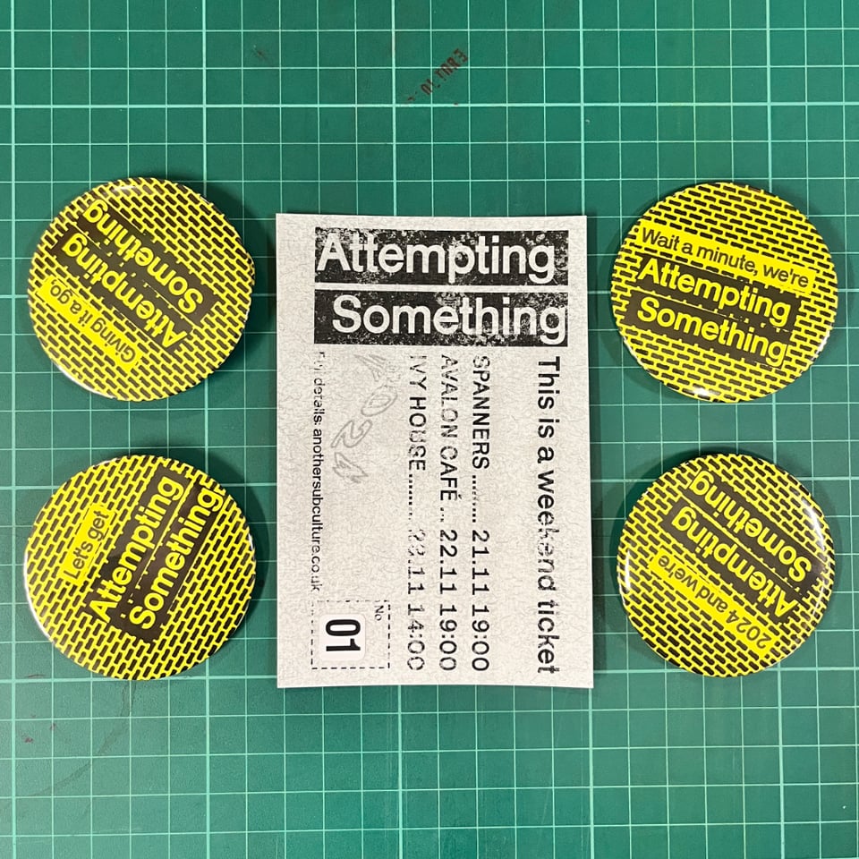 Four badges with slogans like