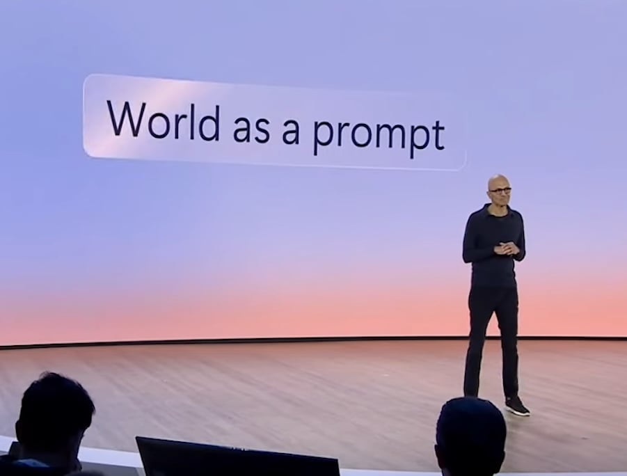 Satya Nadella in front of 'World as a prompt'