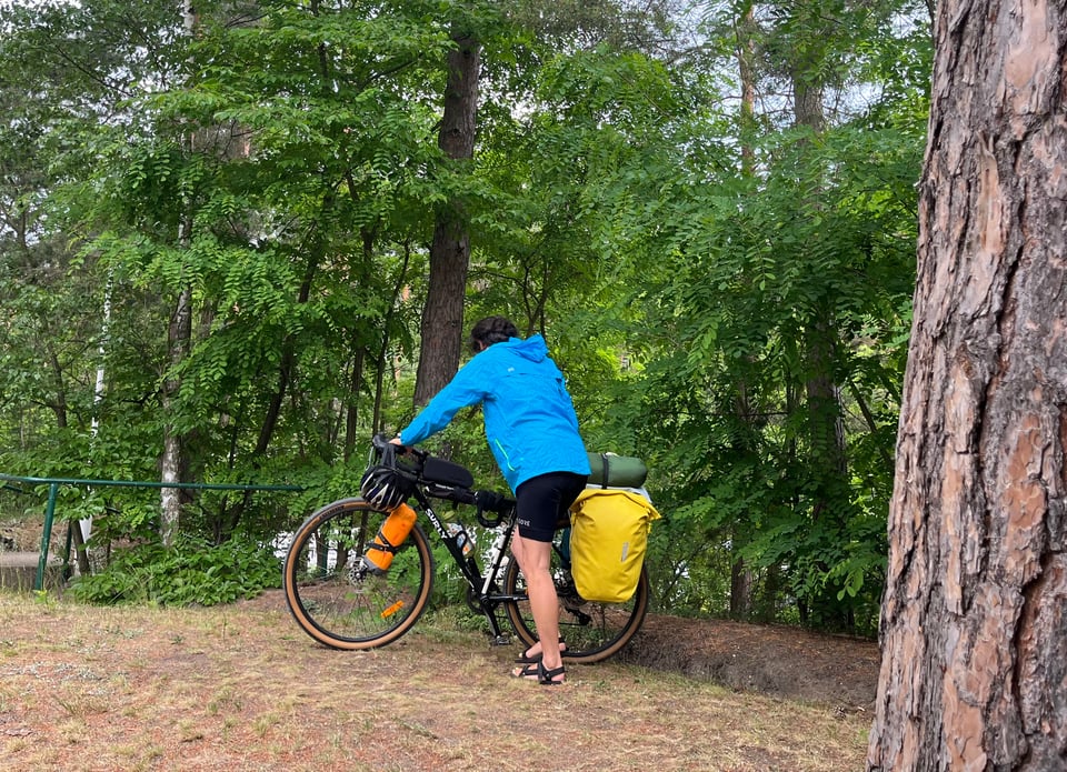 Jenny pushing her laden bike