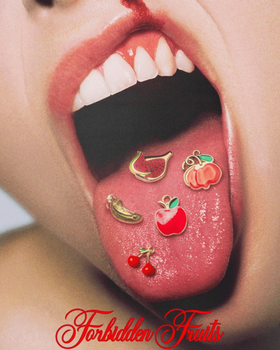 Five small charms—a pickle, a fig, an apple, a cherry, and a pumpkin—resting on a woman's outstretched tongue. The name of the movie, "Forbidden Fruits," is written over it in red, curly script.