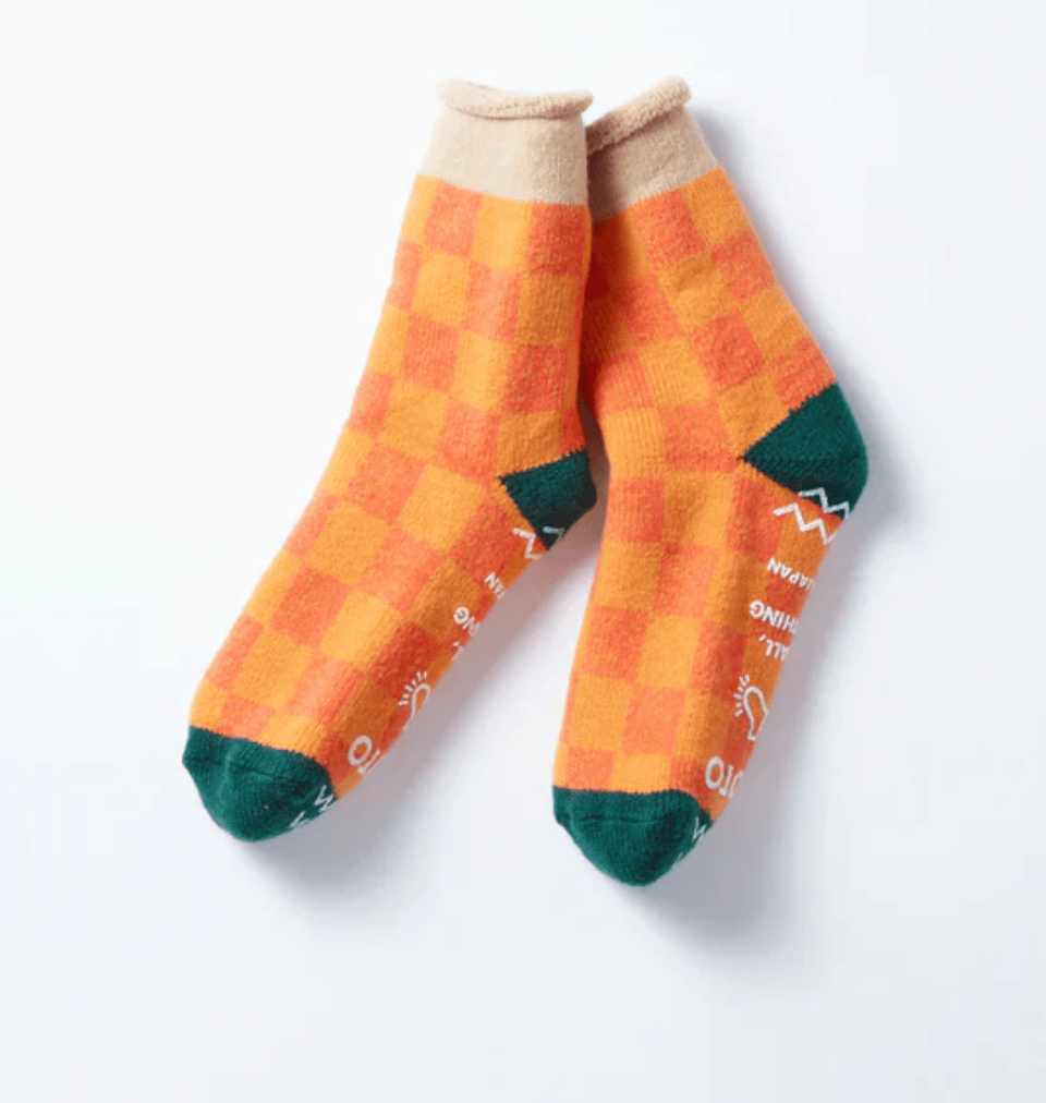 Orange checkered socks with green toes.