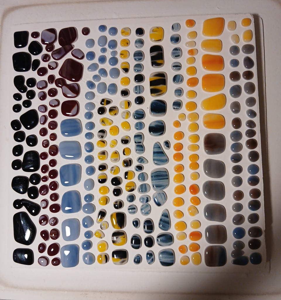 the glass has rounded out into cabochons. a couple of them fused two together too oops