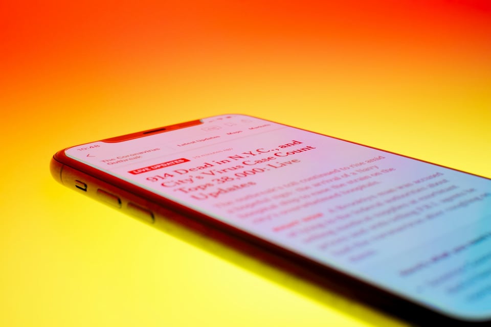 Glasses on
top of a newspaper.  Photo by Christian Lue on Unsplash.