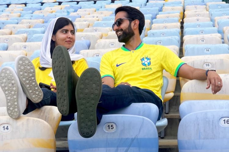 From left: Malala Yousafzai and Asser Malik in Brazil in May 2023.