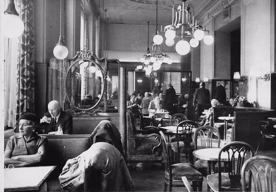 A photo of a Viennese cafe interior; black and white.