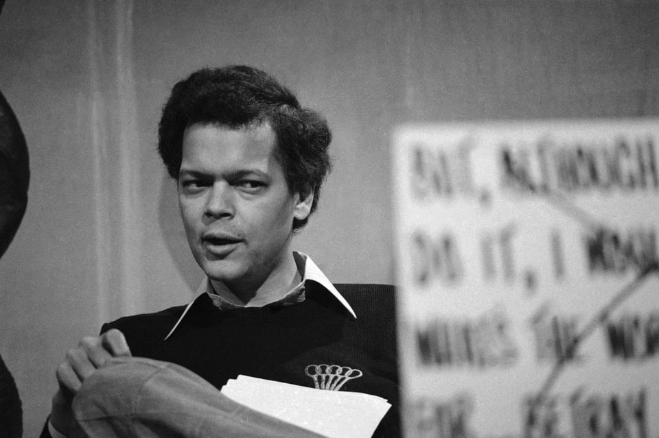 a man holding a sign