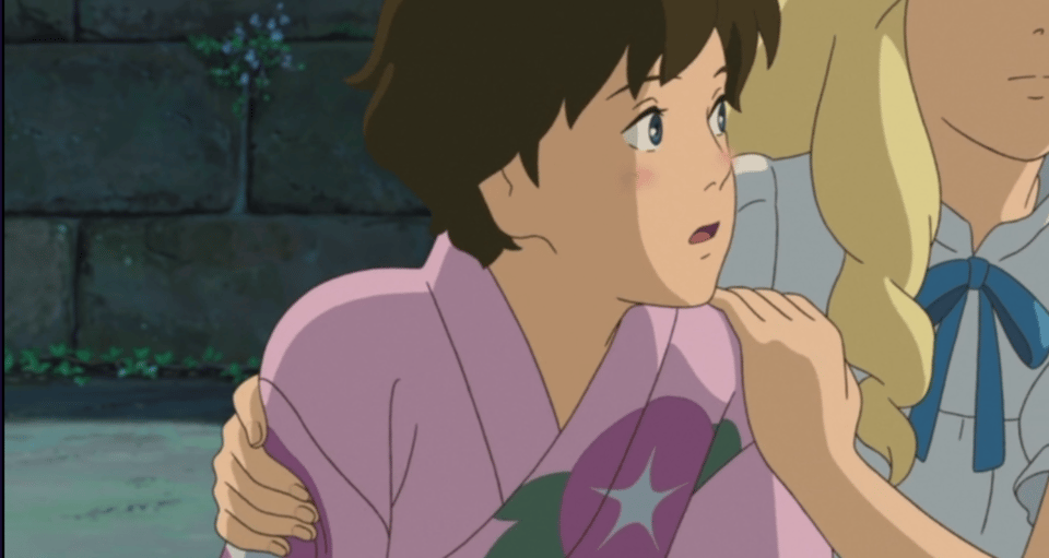 Anna and Marnie are crouched behind a bush, holding each other for no reason.