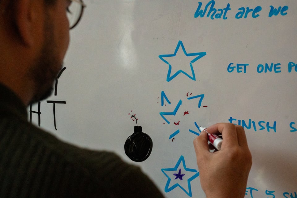 Justin drawing an exploded star.