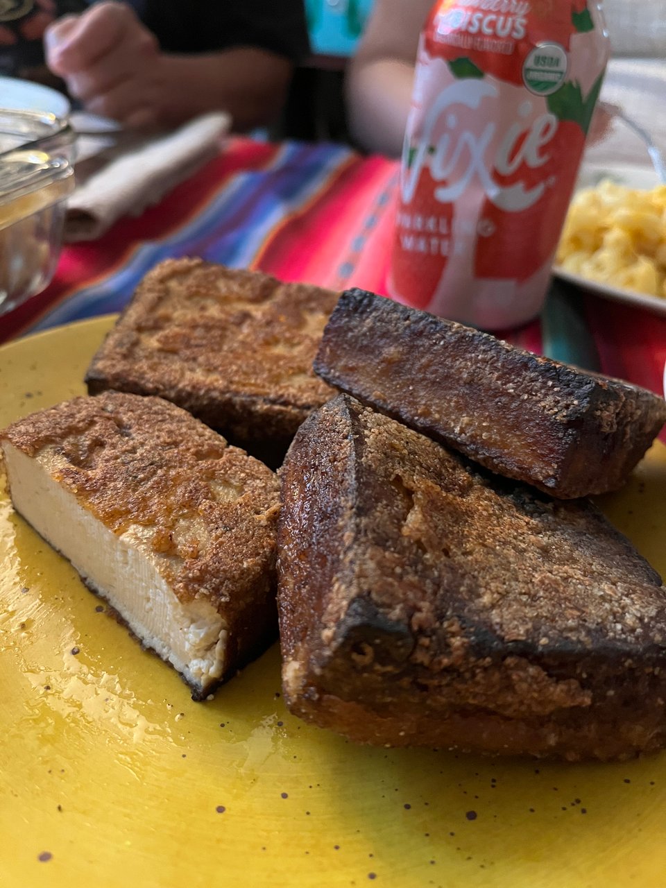 A stack of brownie-sized smoked n fried tofu