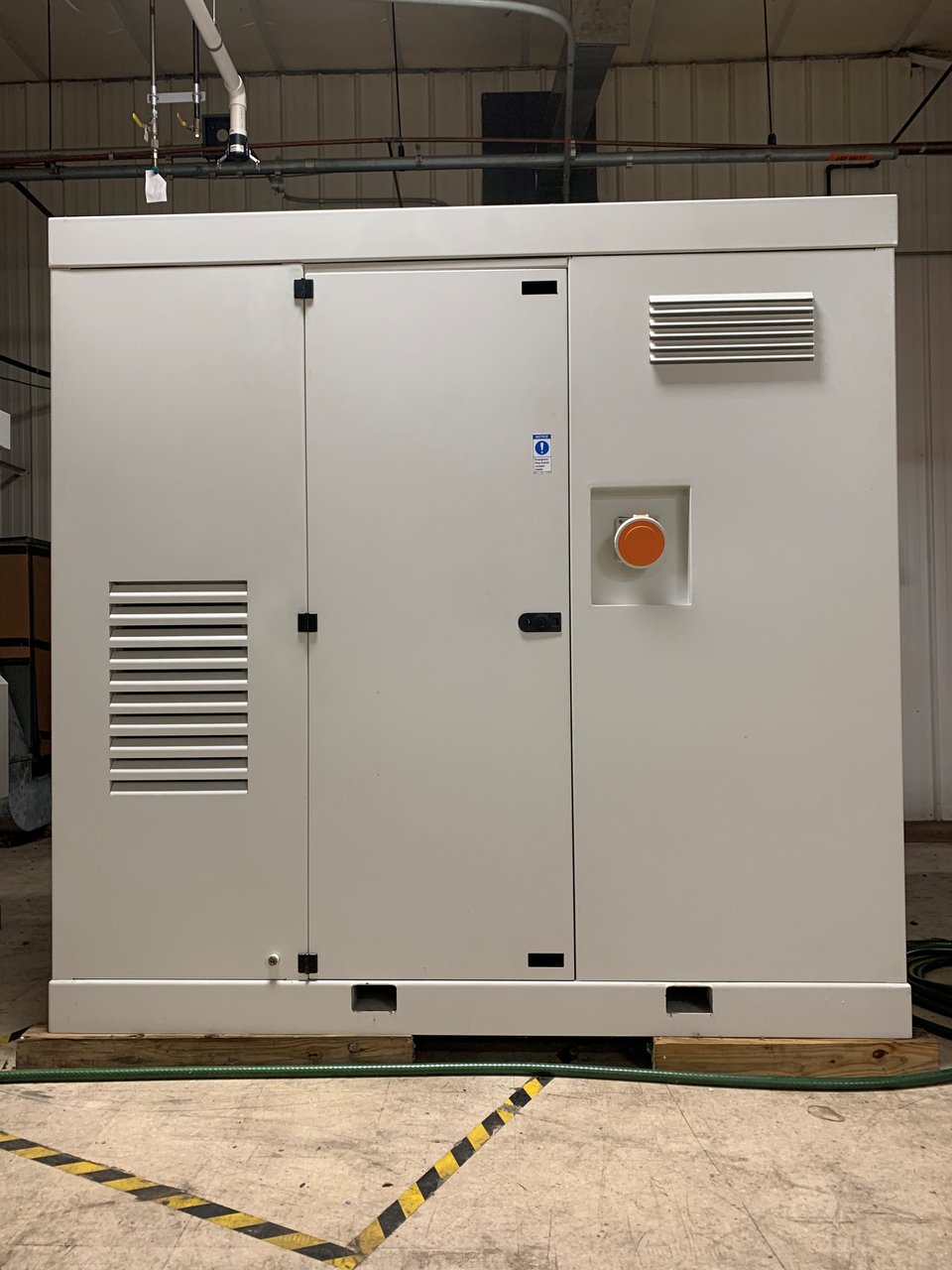 Photo of complete engine / generator package for outdoor installation.
