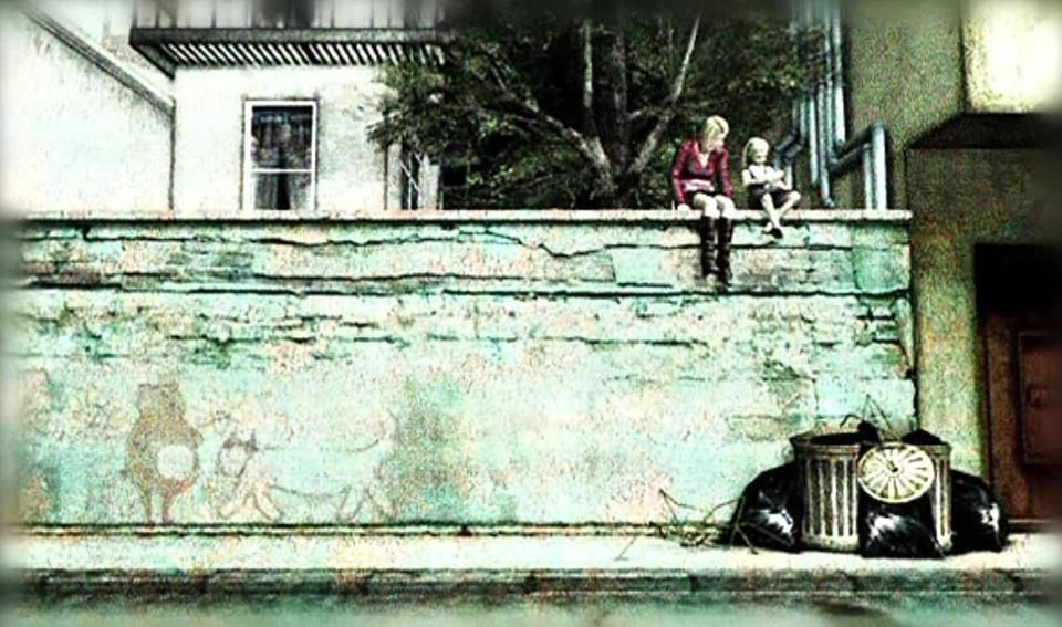 Monika and Laura sitting on a wall together looking at notebook