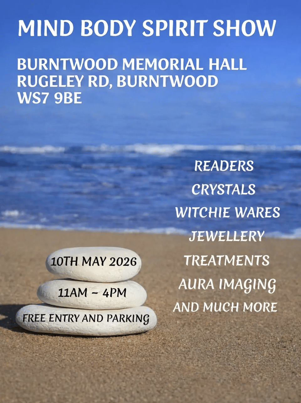 Event poster set against a photo of a sunny beach, with calm blue sea and gentle waves in the background. Three smooth, pale pebbles are stacked on the sand in the lower left, each printed with event details. Bold white text at the top reads: "Mind Body Spirit Show — Burntwood Memorial Hall, Rugeley Rd, Burntwood, WS7 9BE." The stacked pebbles read: "10th May 2026 / 11am – 4pm / Free Entry and Parking." To the right, italic white text lists: "Readers, Crystals, Witchie Wares, Jewellery, Treatments, Aura Imaging, and Much More.