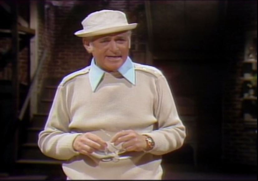 an older man wearing a hat