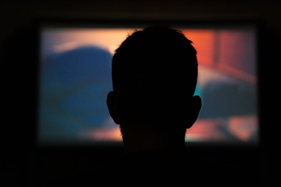 Justin watching a film.
