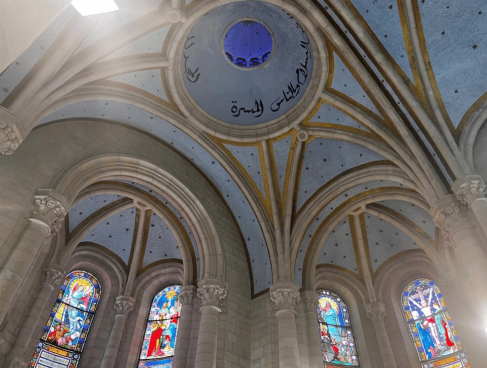 Beautiful blue cantilevered church ceiling with stained glass