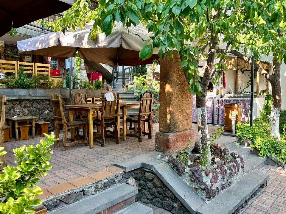 tables in a charming shaded courtyard