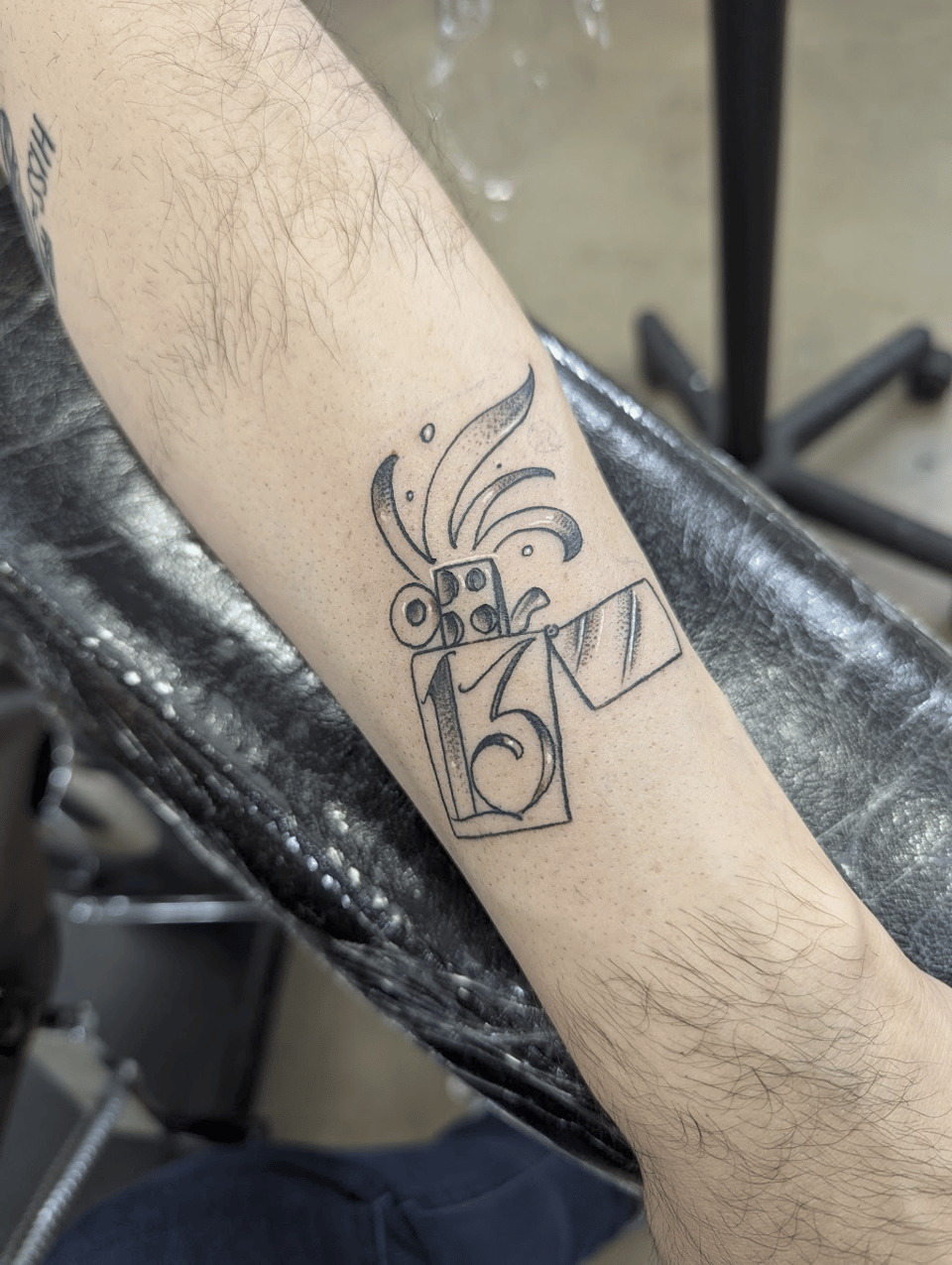 A lighter tattoo.