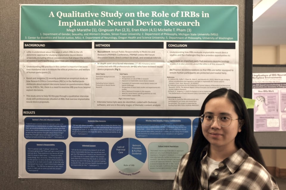 Qingxuan Pan standing with poster presentation, "A Qualitative Study on the Role of IRBs in Implantable Neural Device Research"