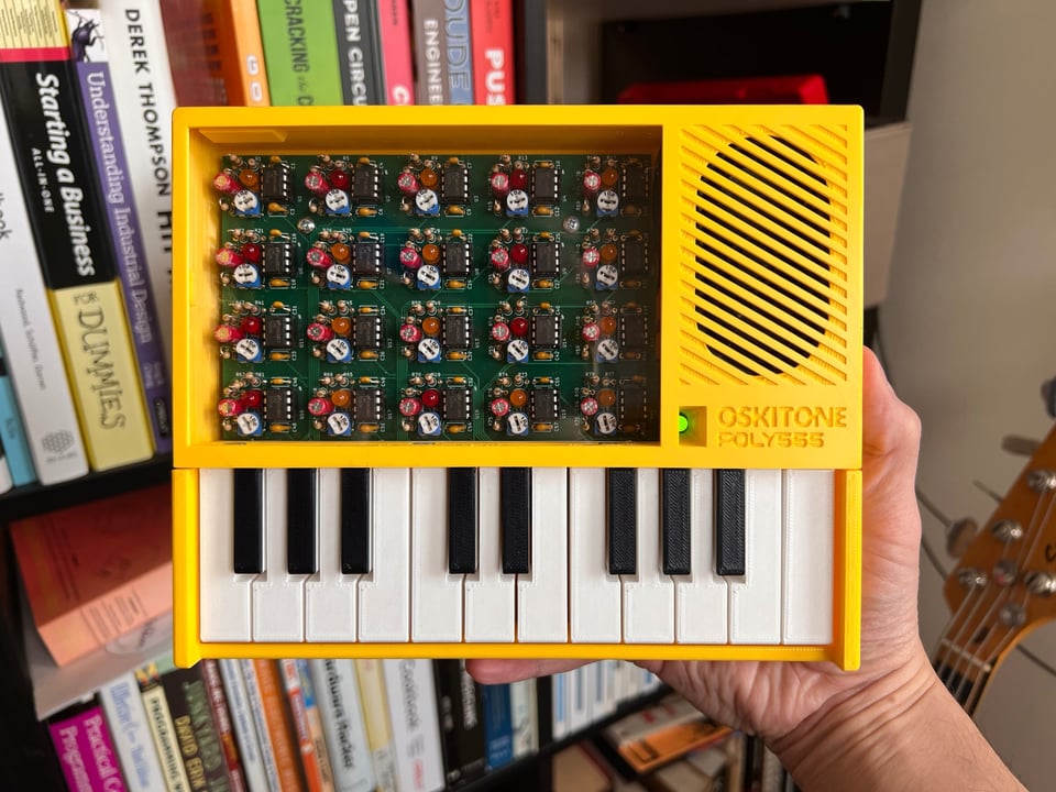 An assembled POLY555 in yellow with green PCB