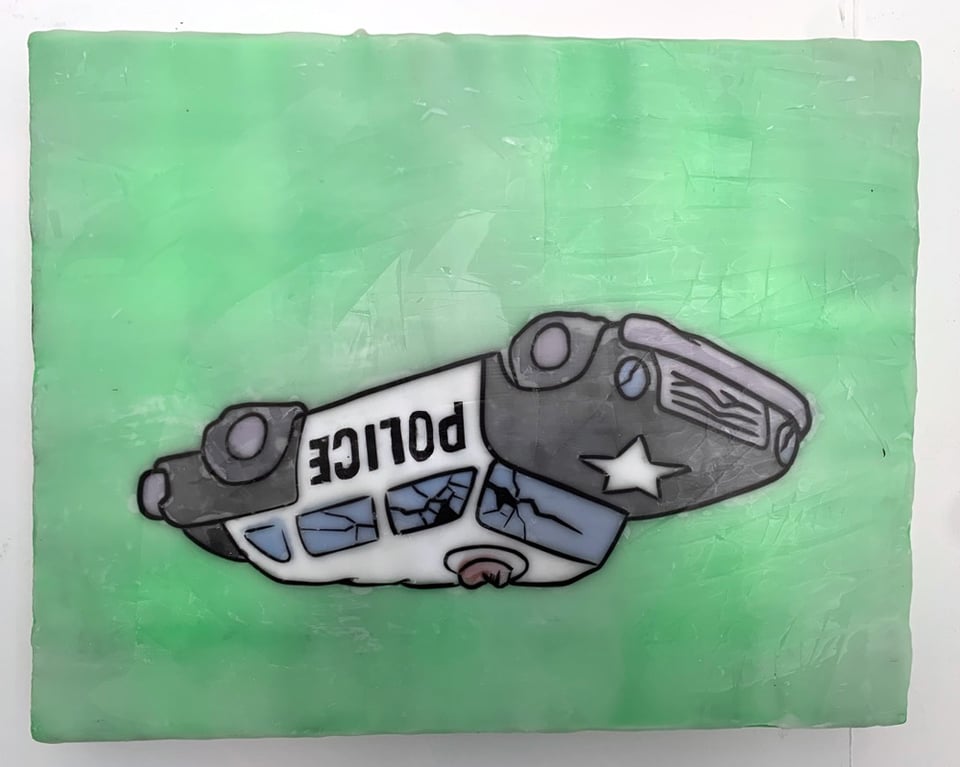 Little painting of an overturned and battered cop car on a green background