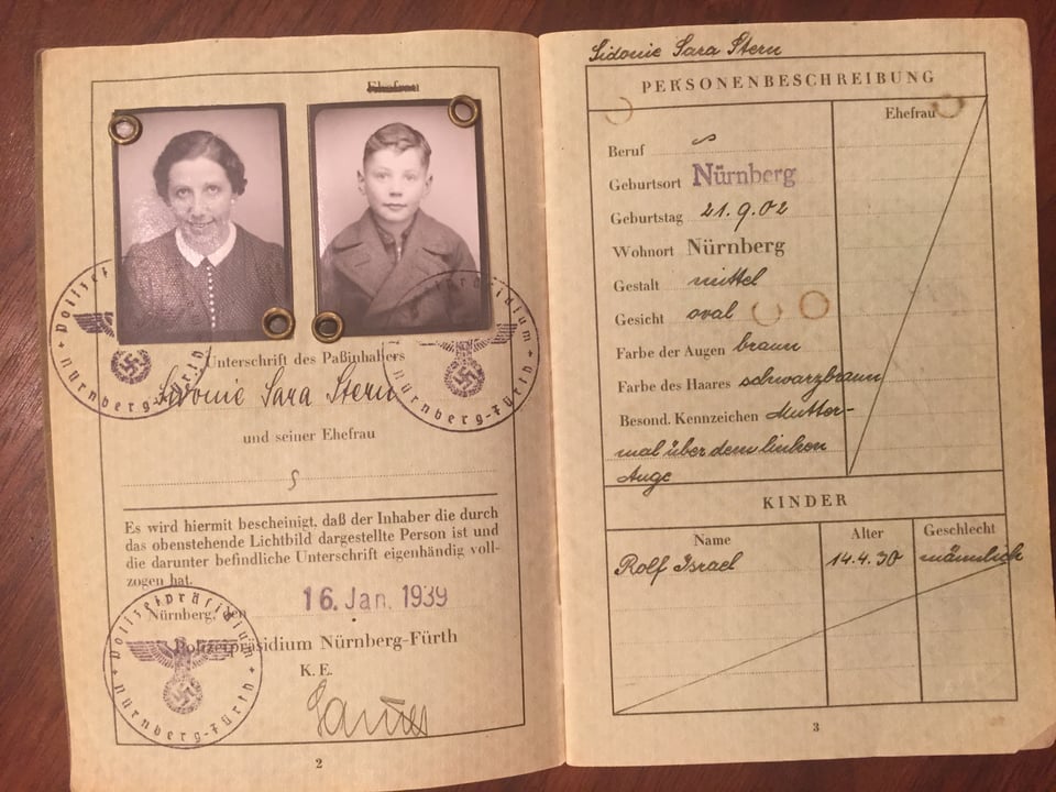 Passport with photos of a woman and a 9-year-old boy, with stamps that include swastikas