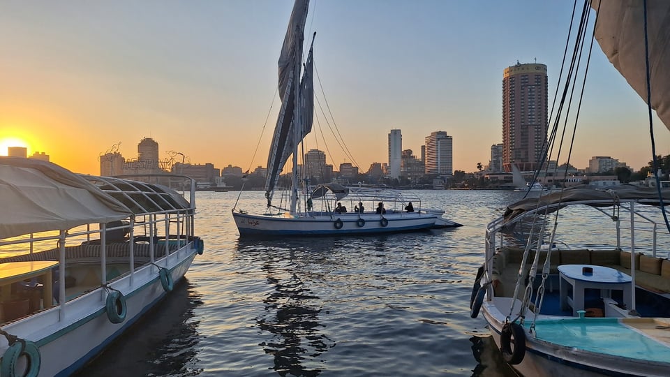 Image of three boats on the Nile before sunset