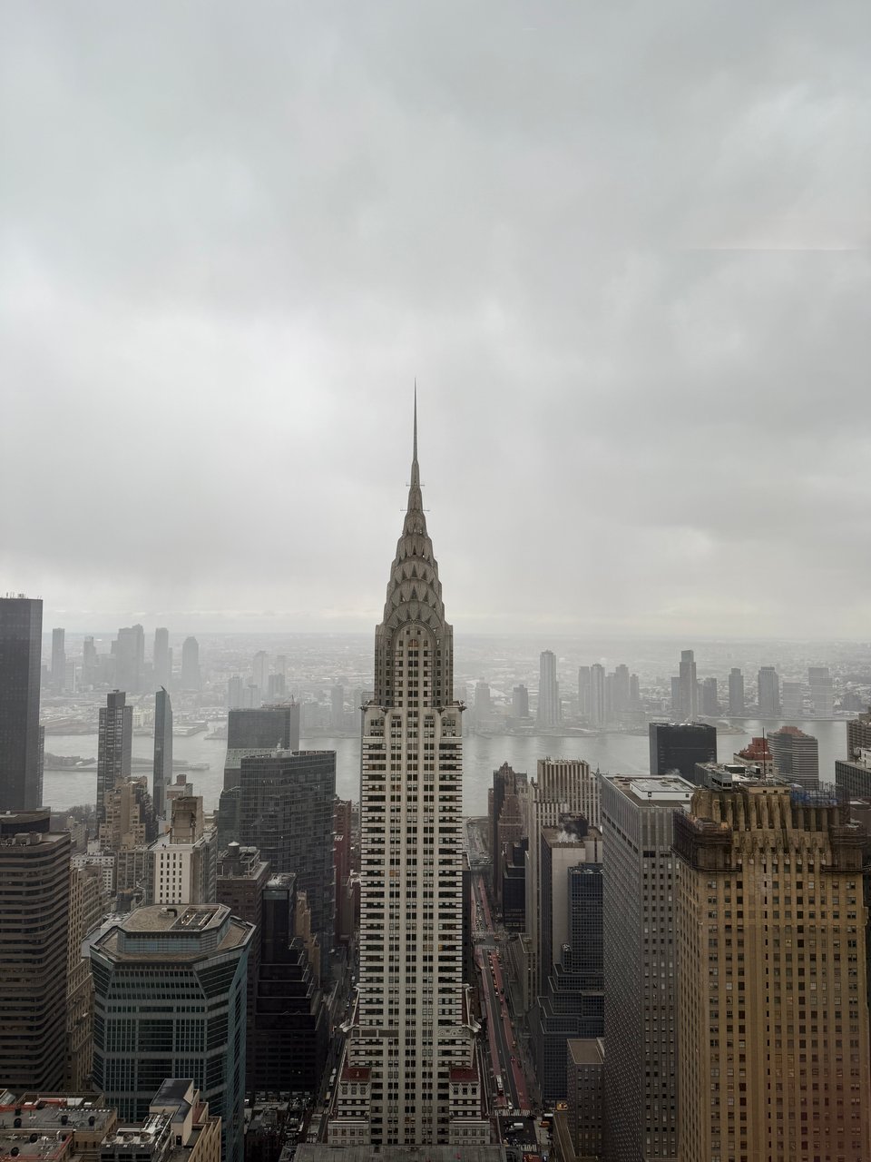 photo of midtown Manhattan from a 55th story window, centered on the Chrysler Bldg.