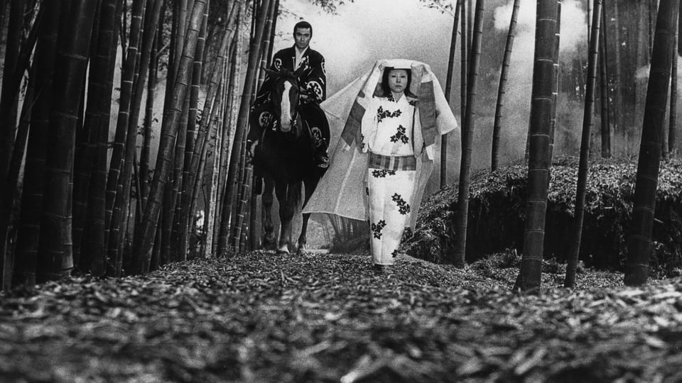 A Scene from Kuroneko with a Samurai and the "ghost woman" walking in a bamboo grove