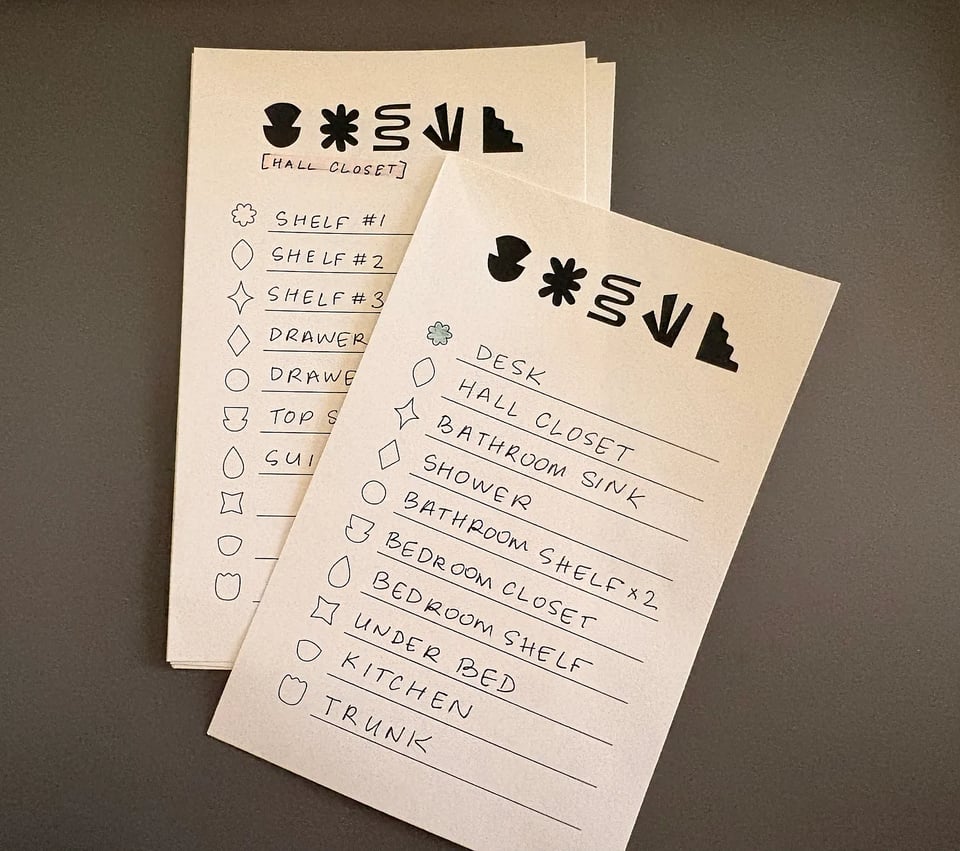 Stack of to-do list papers with squiggly shapes on it.