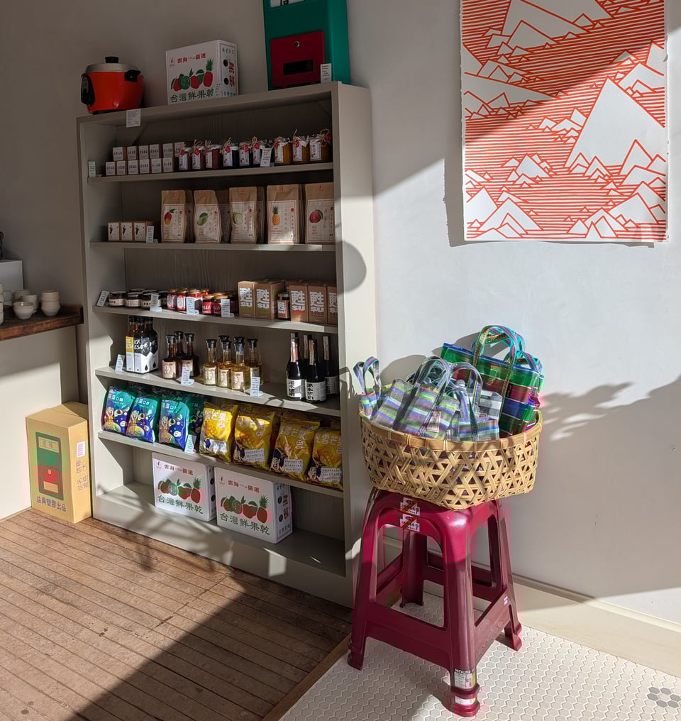 Shelf with various Taiwanese goods including dried fruits, soy sauces, and oils