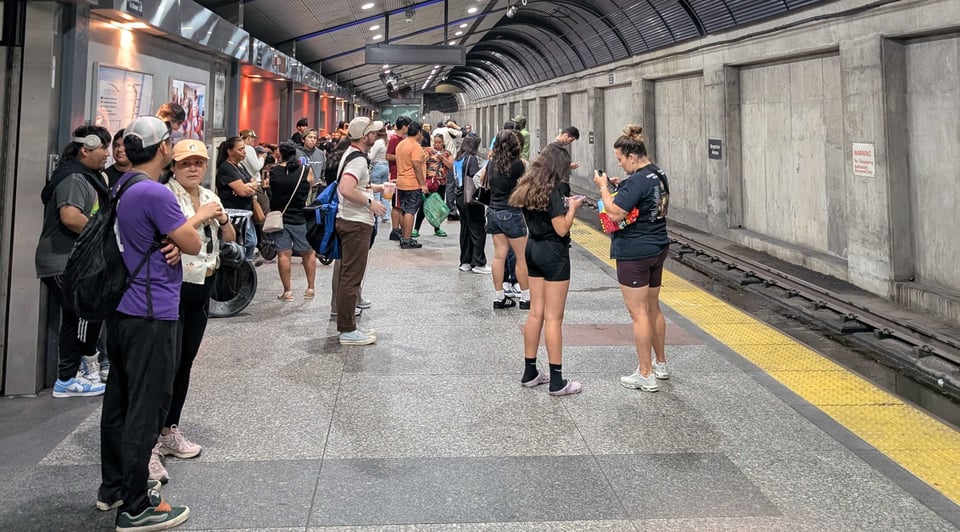 people waiting for bergenline avenue train with no arrival times on display