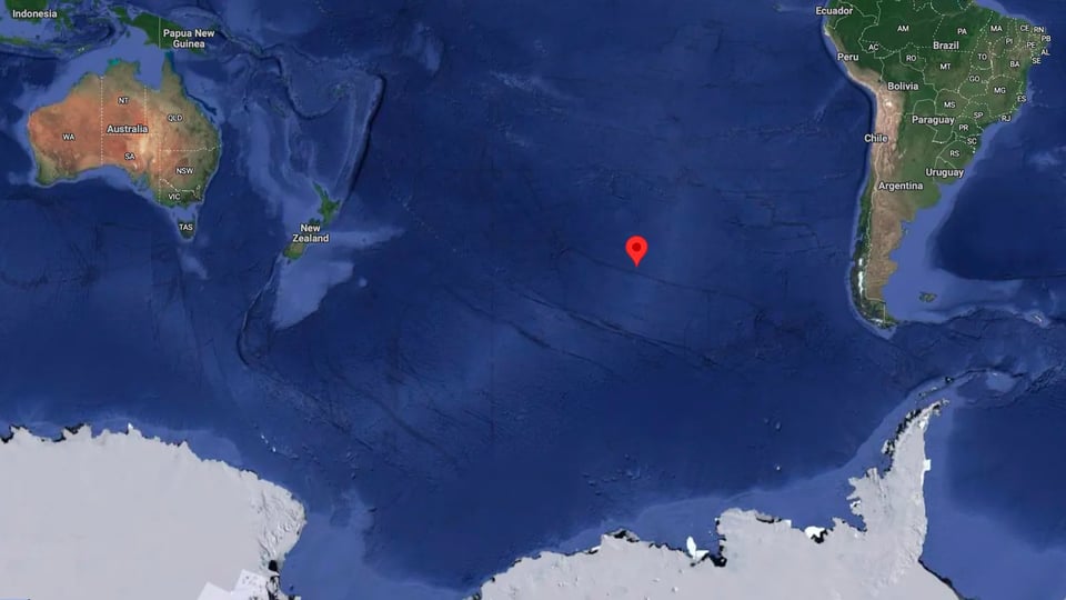 A google map with a red marker showing Point Nemo in the middle of the pacific