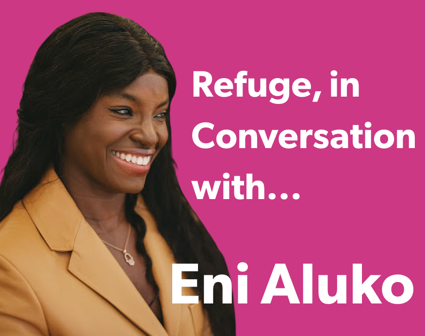 Eni Aluko wearing a yellow blazer and smiling with a bright pink background.